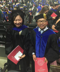 Chao LI (left) and Ye Shen (right) smile at commencement in 2017 when Li earned her doctoral degree.